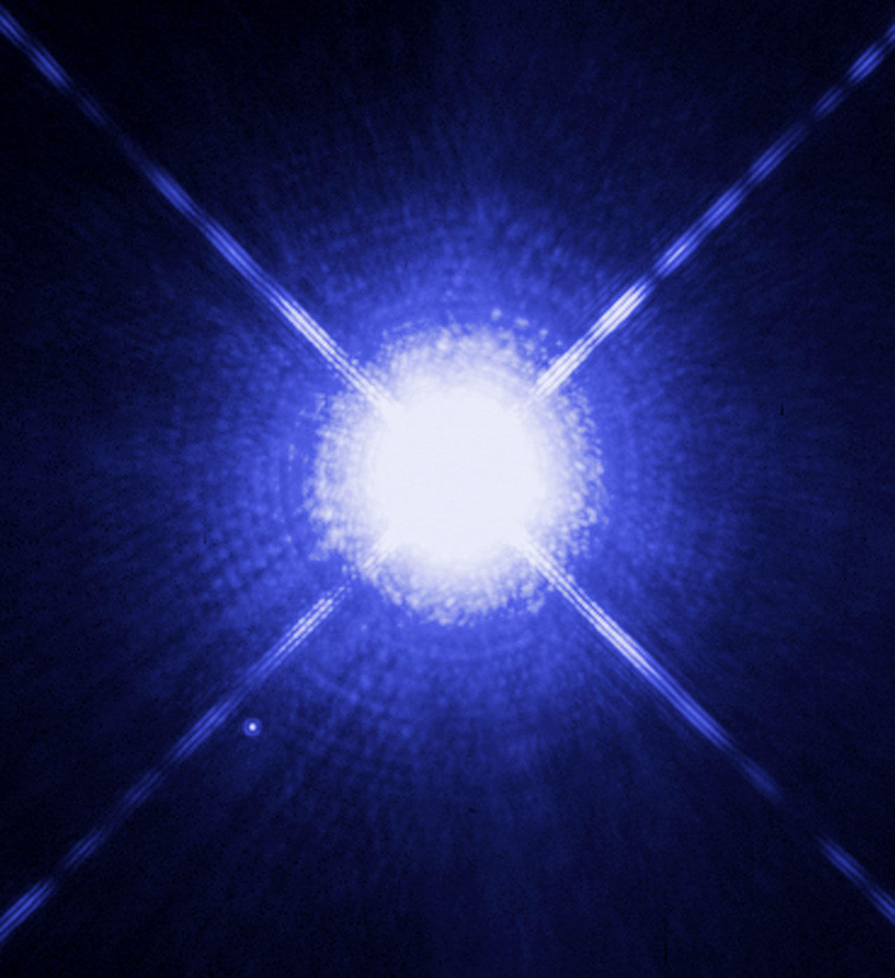 Sirius, a dazzling star with spikes and rings, and a tiny faint dot at its lower left: the white dwarf Sirius B